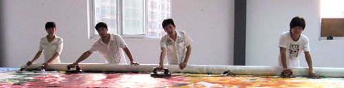 Lots of manpower to mount big Chinese painting